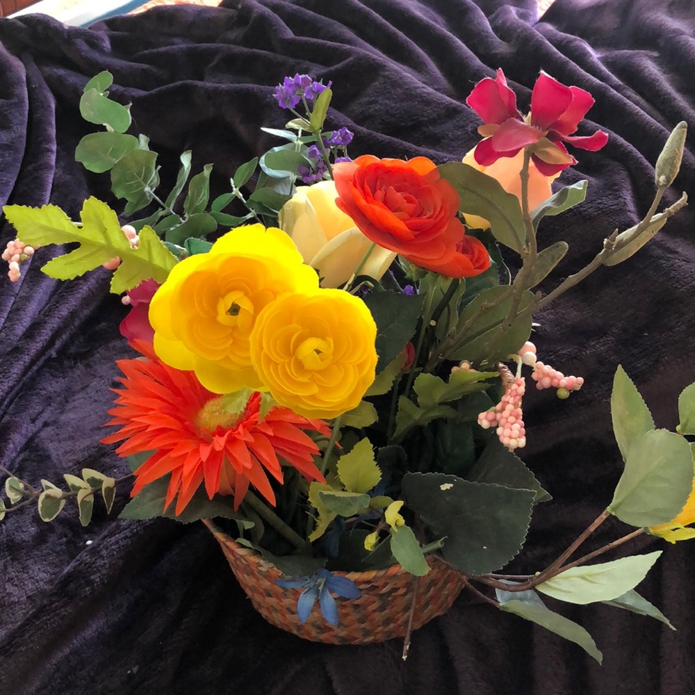 Artificial flowers in  basket done by seller